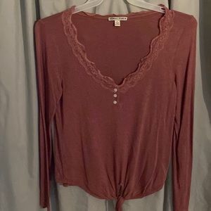 Size large mauve long sleeve lace trim V-neck with tie at bottom.